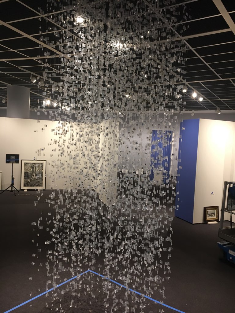 Maria Maneos' exhibit, "5535-2017," consists of more than 300 monofilament lines with one-inch clear glassine bags. Each bag holds a crystal that represents a life lost to addiction.